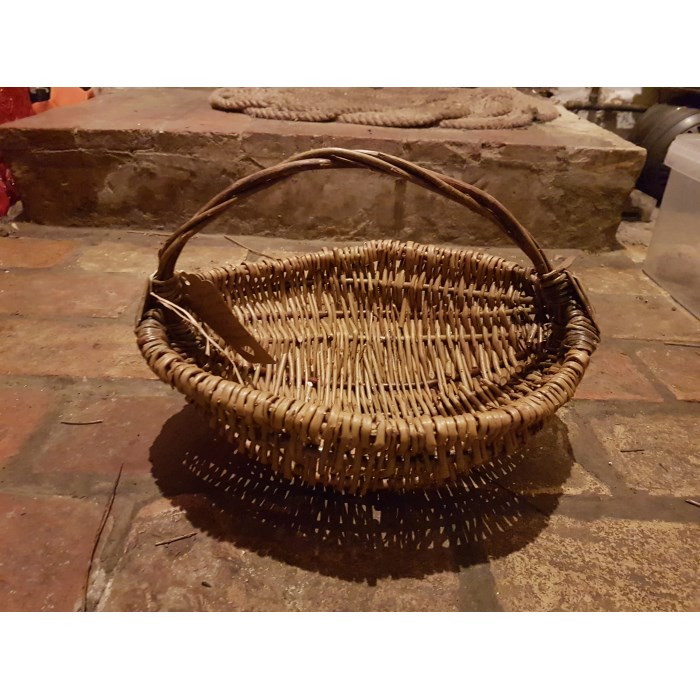 A handmade willow foraging basket plus willow Christmas decorations